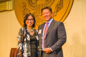 Priscilla Ouchida (left) presents UPS representative Ronald Chang with the Corporate Award. Photo by Joe Shymanski 
