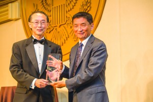 David Lin (left) presents IW Group's Bill Imada with his award. Photo by Joe Shymanski 