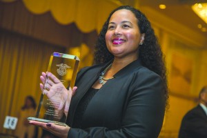 CBS' Tiffany Smith-Anoa'i accepts an award on behalf of "Hawaii Five-0" writers Peter Lenkov and Ken Solarz. Photo by Joe Shymanski 