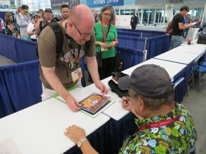 Willie Ito at his Comic Con booth where he signed autographs and met fans after his spotlight discussion. Photo by Tiffany Ujiiye