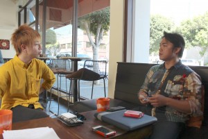 Magician Shoot Ogawa (right) mentors up-and-coming magician Akinobu Mitsui. Photo by Tiffany Ujiiye