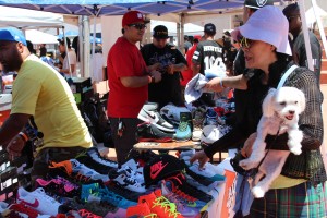 A woman inquires about a pair of Jordan 11's at Little Tokyo's DXC. Photo by Tiffany Ujiiye