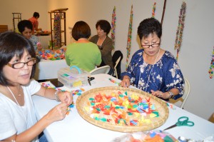 Candace Watase and Rumiko Ota participate in the “Remembering Sadako” event at the Japanese American Cultural and Community Center. Photo by Connie K. Ho
