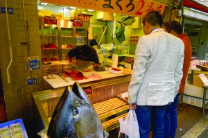 One of the fish sellers at Tokyo’s Tsukiji Fish Market, trimming that morning’s tuna catch and making the freshest sashimi imaginable. Photo by Gil Asakawa 